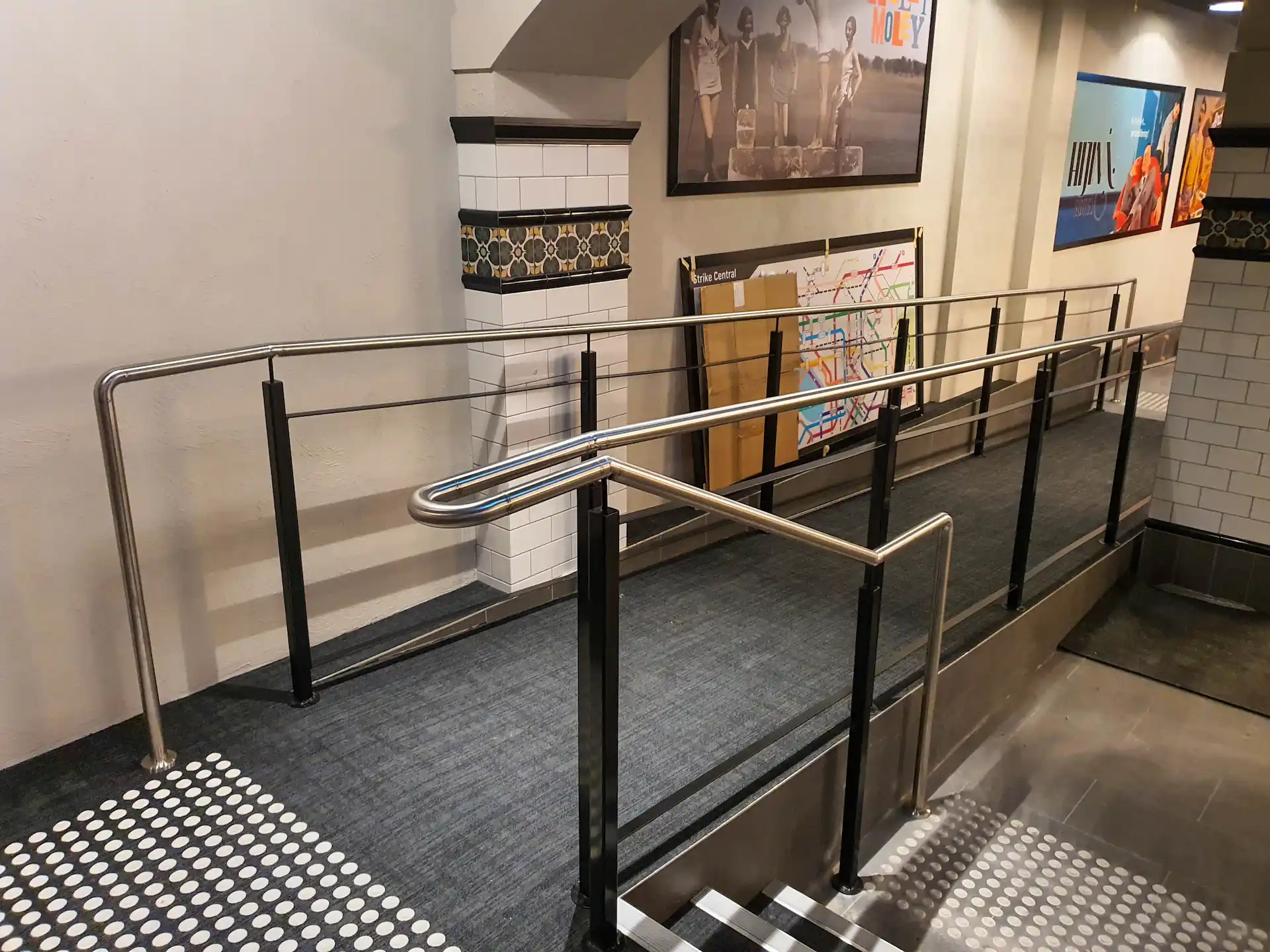 Stainless gold metal frames piled on the ground, pieces of a larger decorative interior project